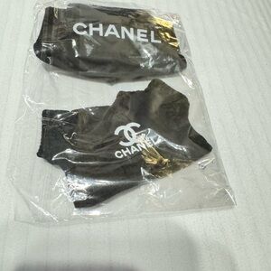 Labubu toy chanel black outfit with white print